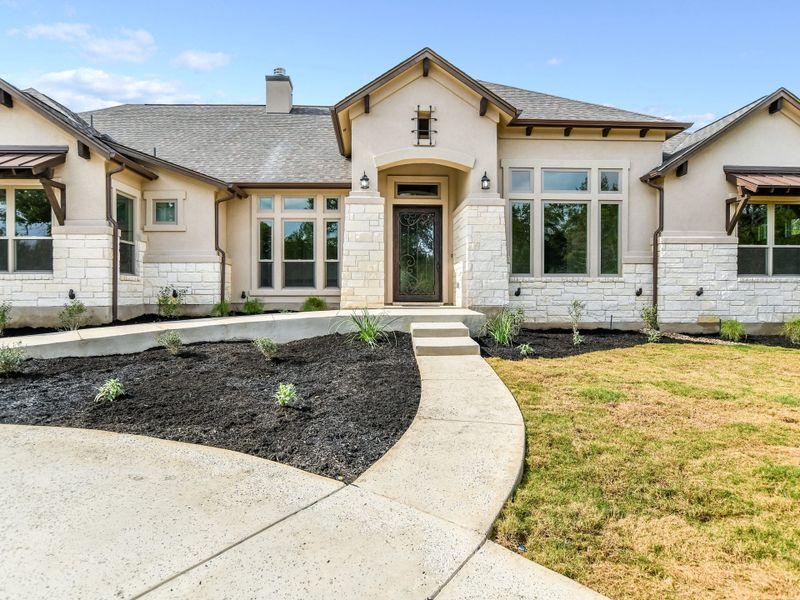 Representative exterior photo of a completed home built from the Coronado I by Giddens Homes in Clearwater Ranch, Liberty Hill, TX (Image 33).