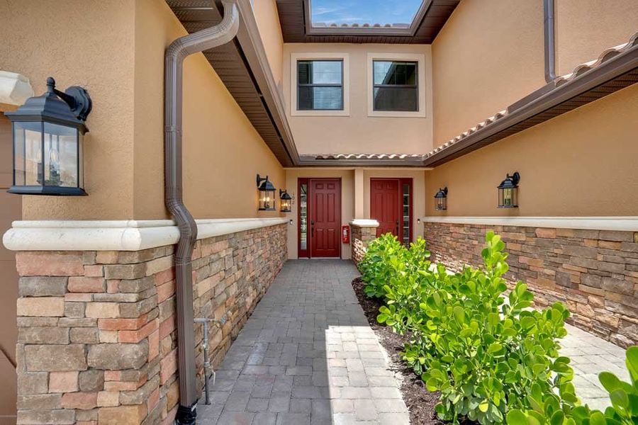 Exterior details and patio area of a home in Esplanade by the Islands Coach Homes, Naples (Image 16). Exterior details and patio area of a home in Esplanade by the Islands Coach Homes, Naples (Image 16).