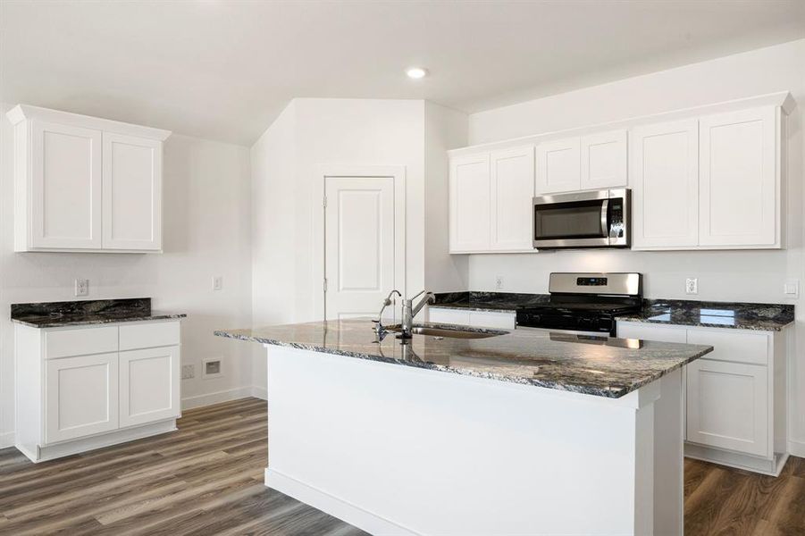 Any chef's dream, this stunning kitchen is perfect for everyday life as well as entertaining family and friends! Extra large kitchen island is perfect for conversation or that much needed space to lay out your party spread for everyone to enjoy! Large windows provide lovely views of your backyard and plenty of natural lighting throughout the day.