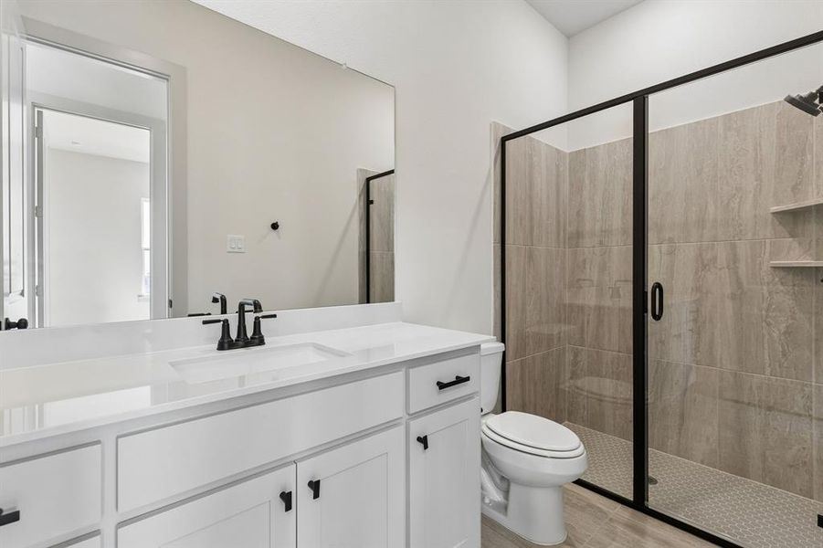 Friends and family will feel right at home in either of the beautifully finished guest baths in our Bella plan. Friends and family will feel right at home in either of the beautifully finished guest baths in our Bella plan.