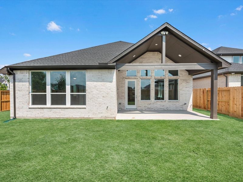 Front exterior of a new home in Tompkins Reserve, Katy, TX, highlighting curb appeal (Image 1).