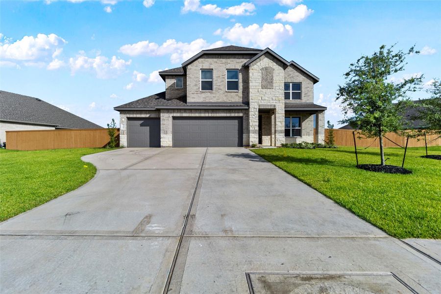 Front exterior of a new home in River Ranch Estates, Dayton, TX, highlighting curb appeal (Image 18). Front exterior of a new home in River Ranch Estates, Dayton, TX, highlighting curb appeal (Image 18).