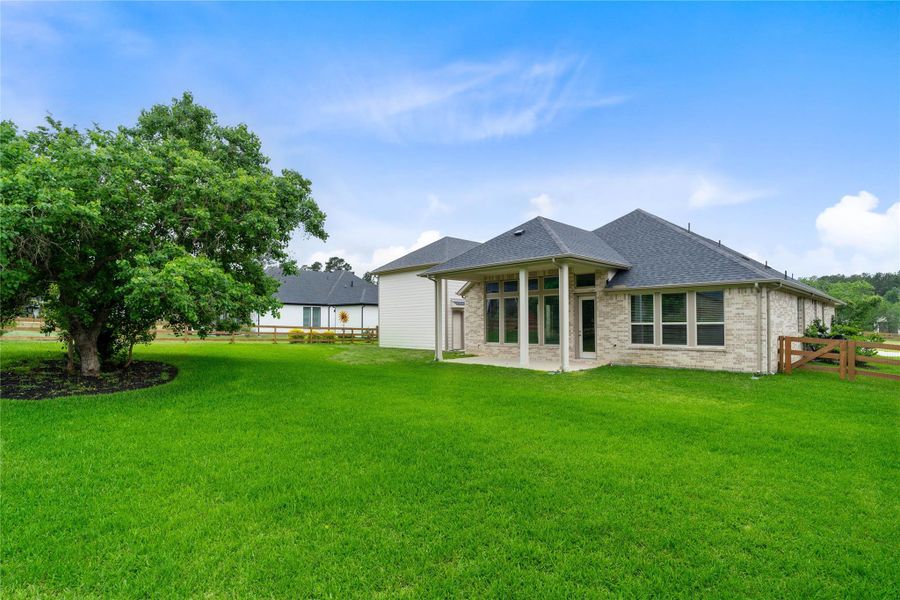 This property features an expansive lot and a charming covered patio that provides a seamless transition for indoor-outdoor living. The home offers a serene and spacious environment for both relaxation and entertaining, perfectly blending function and style. This property features an expansive lot and a charming covered patio that provides a seamless transition for indoor-outdoor living. The home offers a serene and spacious environment for both relaxation and entertaining, perfectly blending function and style.