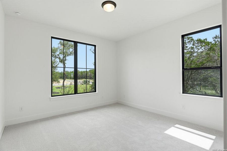 Spacious, unfurnished interior of a new home in Enchanted Bluff, San Antonio (Image 42).