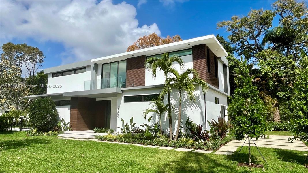 Front exterior of a new home in , South Miami, FL, highlighting curb appeal (Image 16).