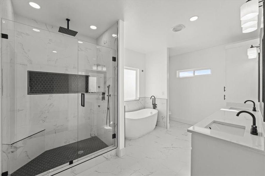 Bathroom with vanity and shower with separate bathtub