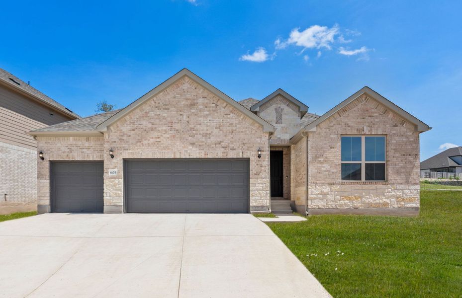Front exterior of a new home in Crescent Bluff, Georgetown, TX, highlighting curb appeal (Image 22).