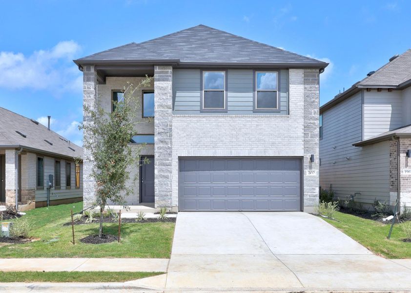 Front exterior of a new home in Trinity Ranch, Elgin, TX, highlighting curb appeal (Image 28).