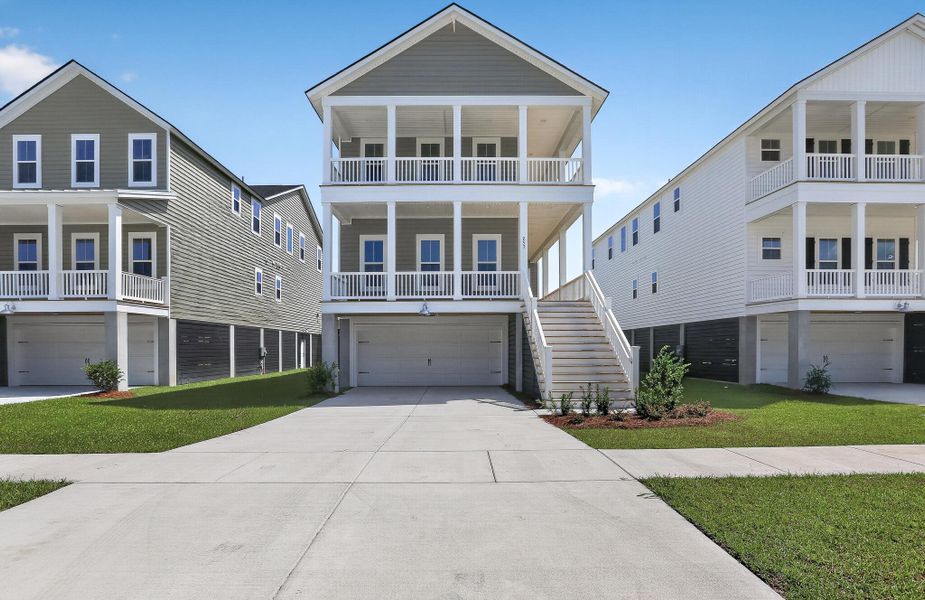 Front exterior of a new home in Heron's Walk at Summers Corner, Summerville, SC, highlighting curb appeal (Image 1). Front exterior of a new home in Heron's Walk at Summers Corner, Summerville, SC, highlighting curb appeal (Image 1).