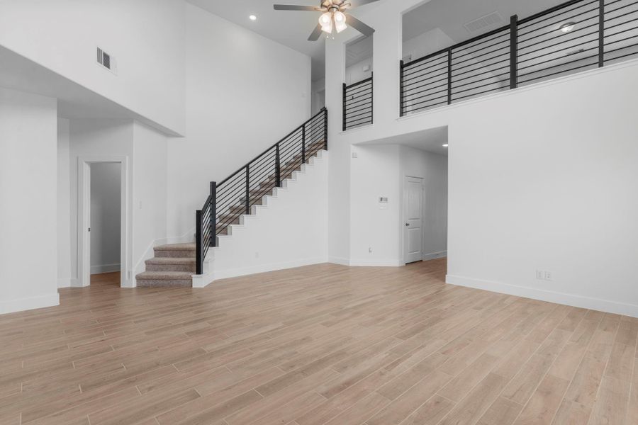 Modern cable iron staircase adds a touch of elegance to the expansive living space. **Image Representative of Plan Only and May Vary as Built**.