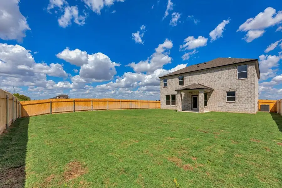 Exterior details and patio area of a home in Mustang Valley, Manor (Image 25).