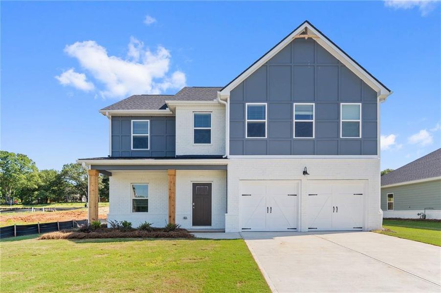 Front exterior of a new home in Conner Springs, Social Circle, GA, highlighting curb appeal (Image 2). Front exterior of a new home in Conner Springs, Social Circle, GA, highlighting curb appeal (Image 2).