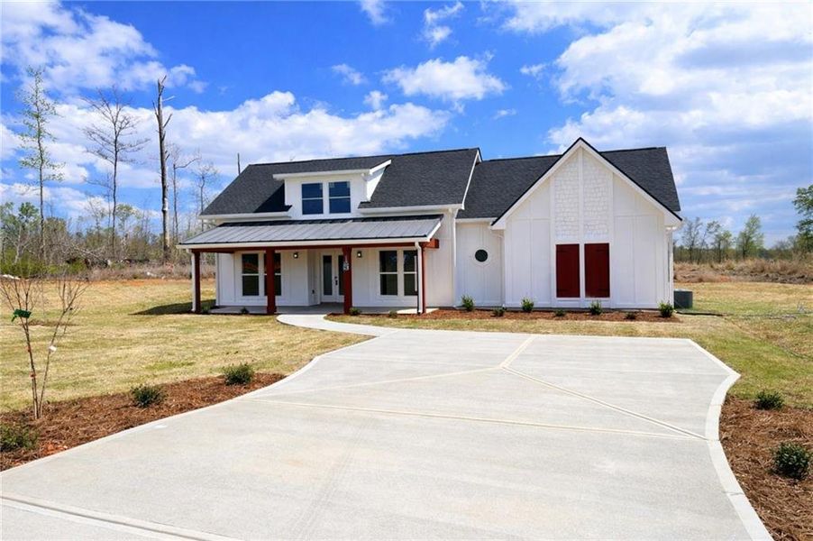 Front exterior of a new home in , Griffin, GA, highlighting curb appeal (Image 18).
