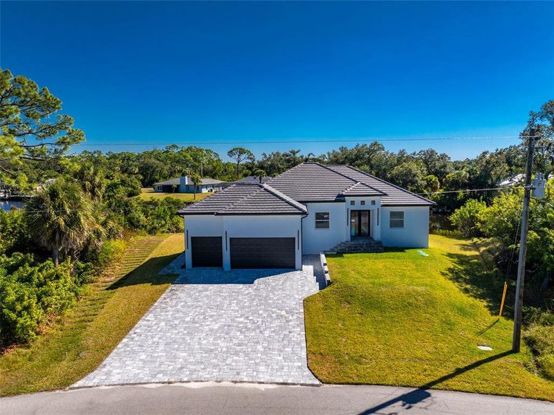 Front exterior of a new home in , Port Charlotte, FL, highlighting curb appeal (Image 28). Front exterior of a new home in , Port Charlotte, FL, highlighting curb appeal (Image 28).