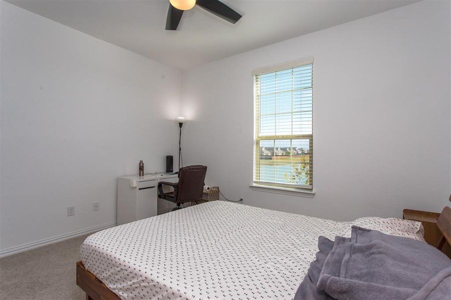 Bedroom with carpet floors and ceiling fan