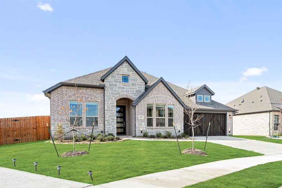 Front exterior of a new home in Villages of Walnut Grove, Midlothian, TX, highlighting curb appeal (Image 22).