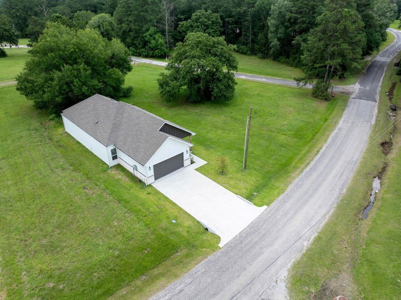 Front exterior of a new home in , Trinity, TX, highlighting curb appeal (Image 30).
