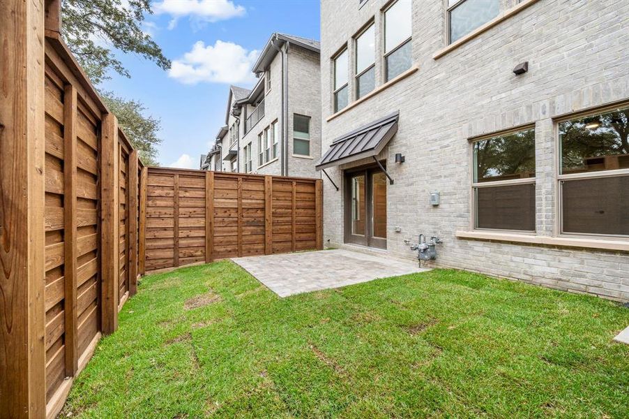 You'll enjoy a private, fenced outdoor area just off the main floor flex space.