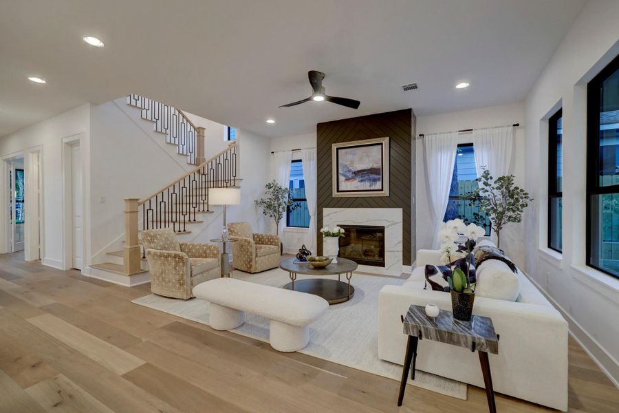 Spacious living room features ample windows, fireplace with chevron shiplap*photos are of a previously constructed home by the builder. 1527 Hewitt may have different selections at builders sole discretion. These photos are not meant to be an exact representation of 1527 Hewitt.