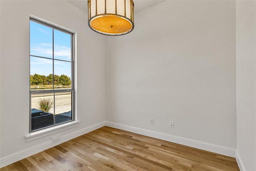 Spare room featuring light hardwood / wood-style flooring