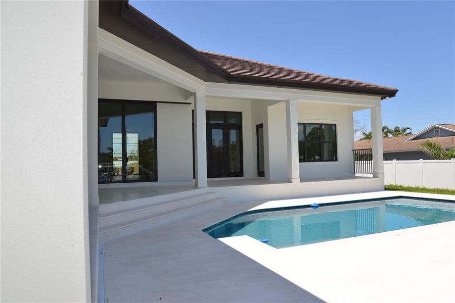 Front exterior of a new home in , Sarasota, FL, highlighting curb appeal (Image 18).