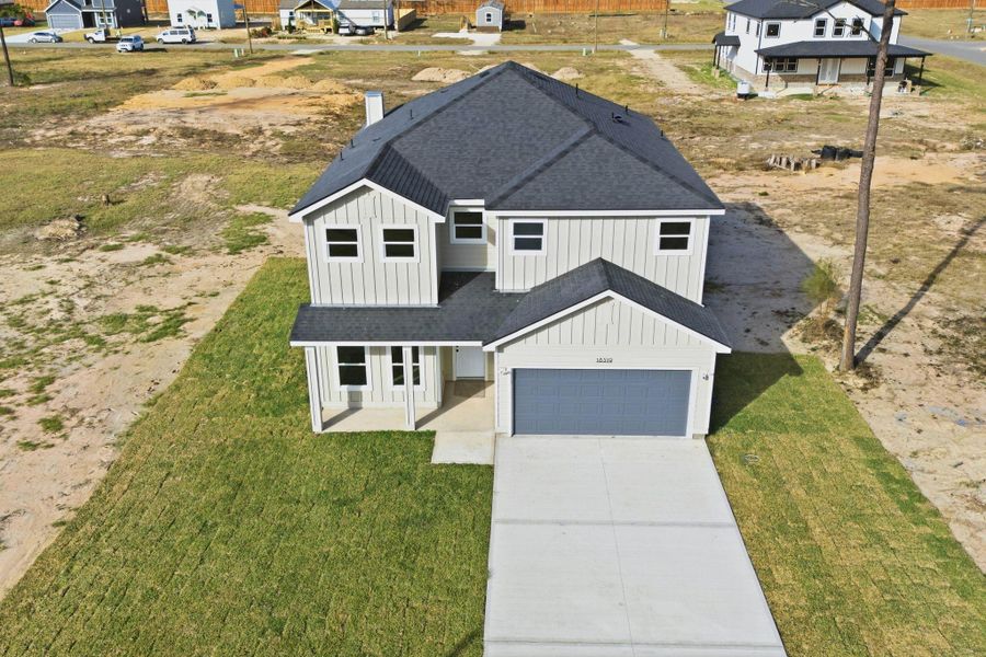 Front exterior of a new home in , Conroe, TX, highlighting curb appeal (Image 23).
