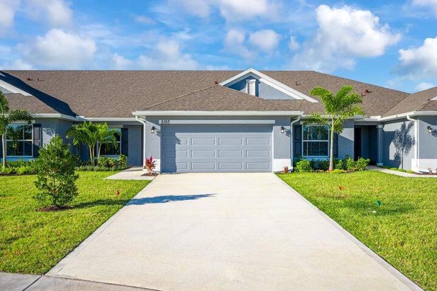 Front exterior of a new home in Waterstone Villas, Fort Pierce, FL, highlighting curb appeal (Image 1). Front exterior of a new home in Waterstone Villas, Fort Pierce, FL, highlighting curb appeal (Image 1).