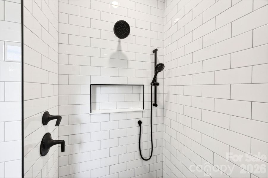 Floor to ceiling tiled primary shower