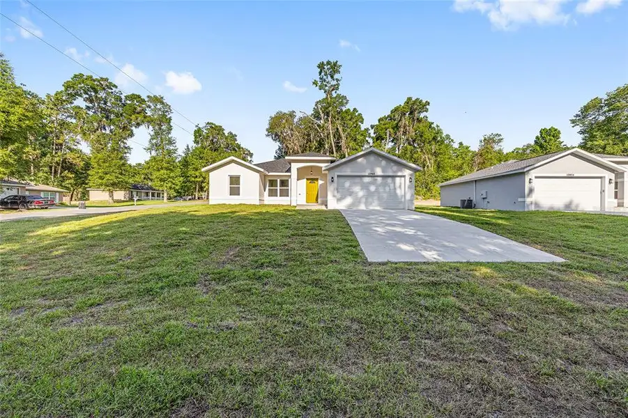 Front exterior of a new home in , Summerfield, FL, highlighting curb appeal (Image 1). Front exterior of a new home in , Summerfield, FL, highlighting curb appeal (Image 1).