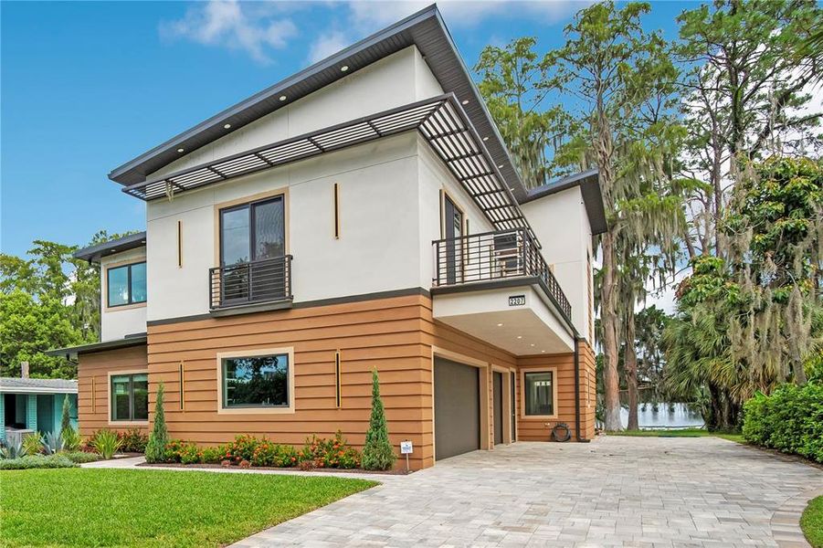 Front exterior of a new home in , Winter Park, FL, highlighting curb appeal (Image 2). Front exterior of a new home in , Winter Park, FL, highlighting curb appeal (Image 2).
