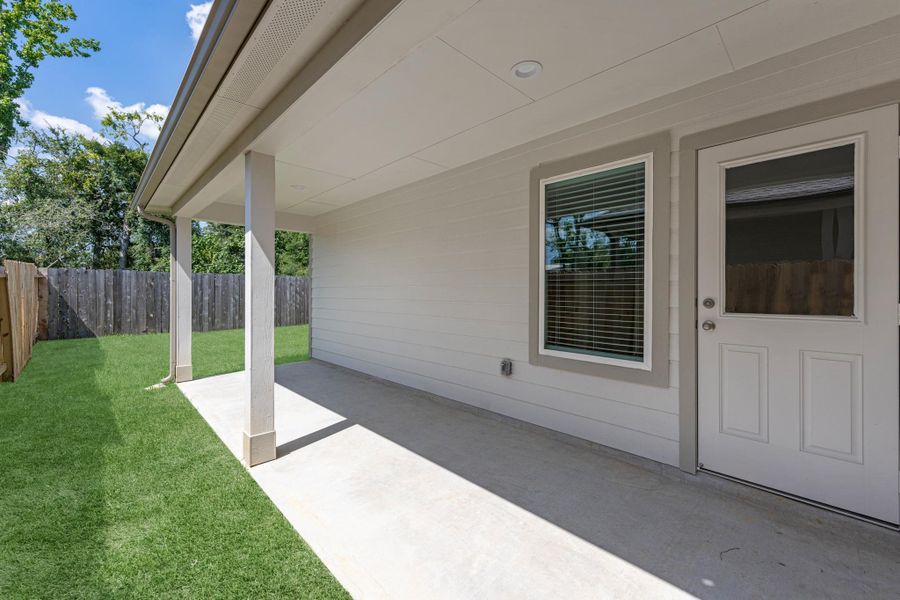 Exterior details and patio area of a home in Cypresswood Landing, Humble (Image 3).