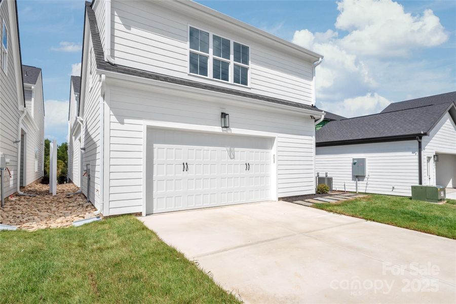 Front exterior of a new home in , Davidson, NC, highlighting curb appeal (Image 26).