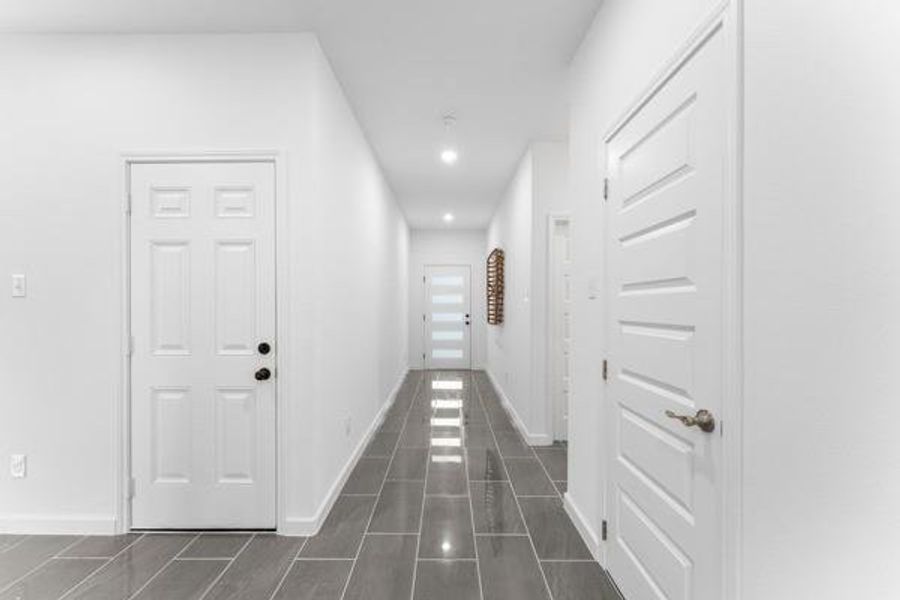 Hallway with baseboards and recessed lighting Hallway with baseboards and recessed lighting