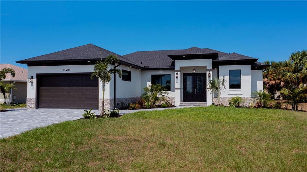 Front exterior of a new home in , Port Charlotte, FL, highlighting curb appeal (Image 25).