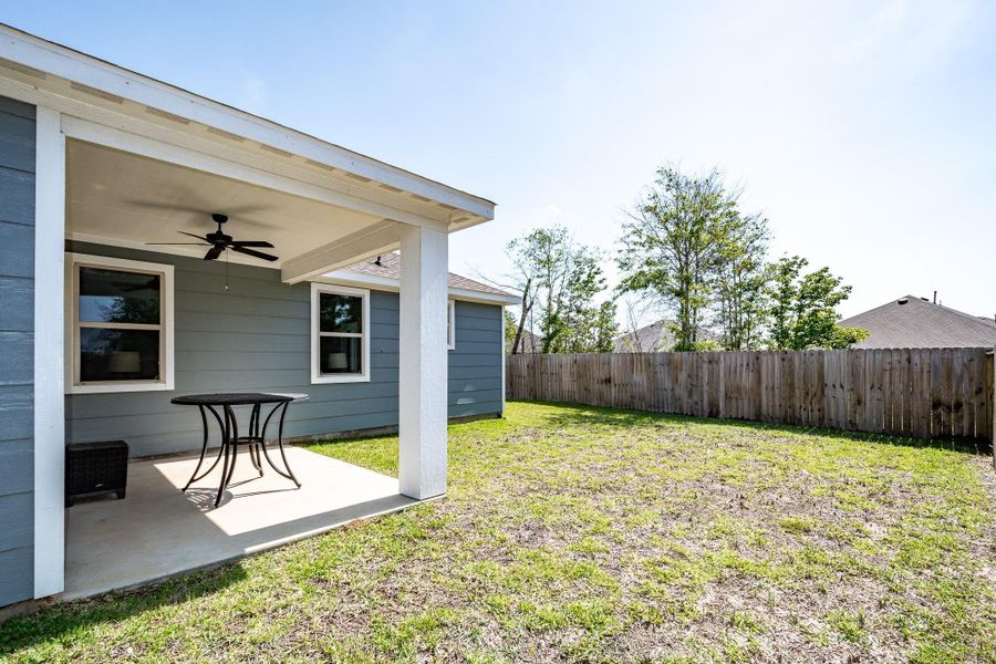 Spacious backyard view from the covered outdoor living space.