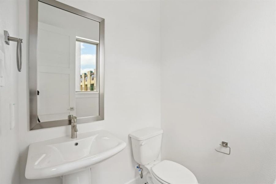 Bathroom with a sink and toilet