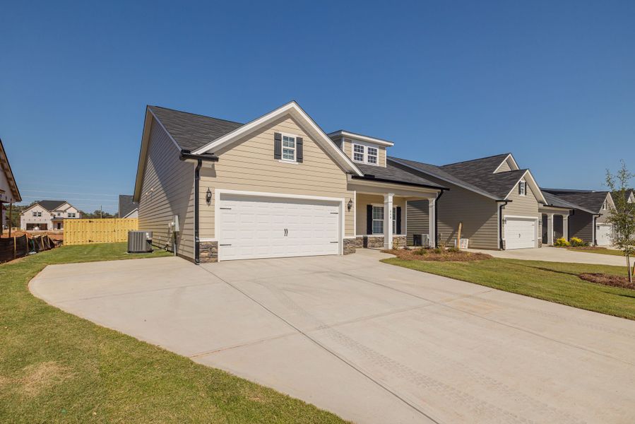 Front exterior of a new home in The Sanctuary, Aiken, SC, highlighting curb appeal (Image 24). Front exterior of a new home in The Sanctuary, Aiken, SC, highlighting curb appeal (Image 24).