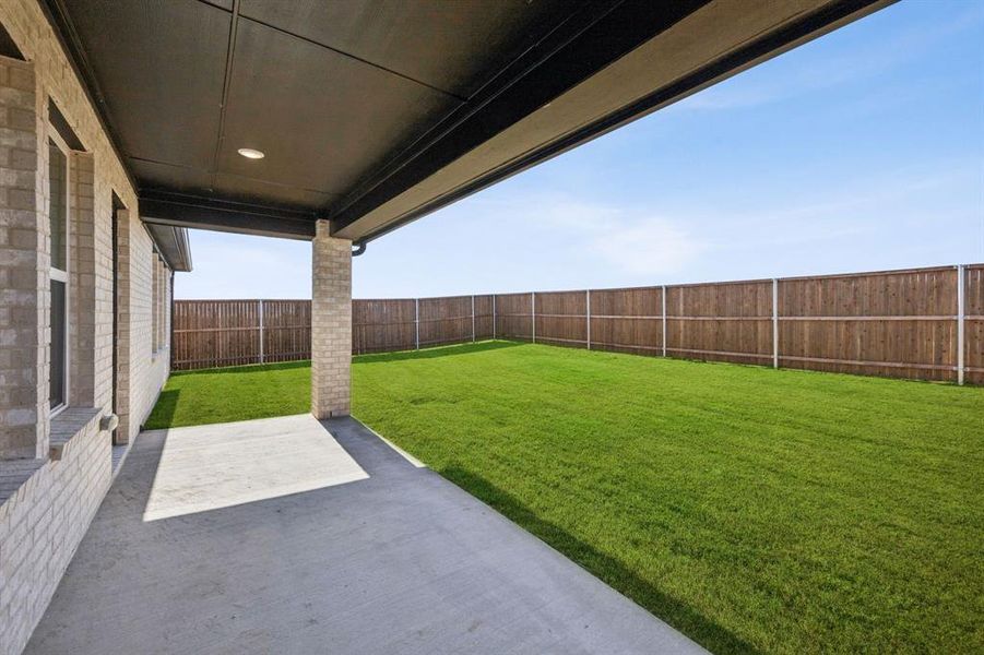 Exterior details and patio area of a home in Santorini, Seagoville (Image 2).