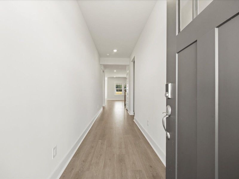 Spacious, unfurnished interior of a new home in The Coves at Lakes of Cane Bay II, Summerville (Image 22).