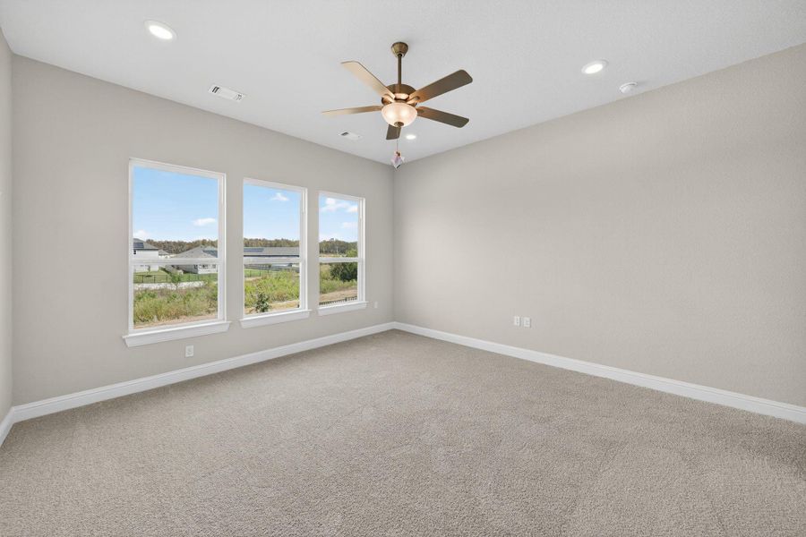 Spare room featuring light colored carpet, recessed lighting, and a ceiling fan Spare room featuring light colored carpet, recessed lighting, and a ceiling fan