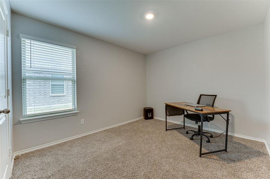 Office area with light colored carpet