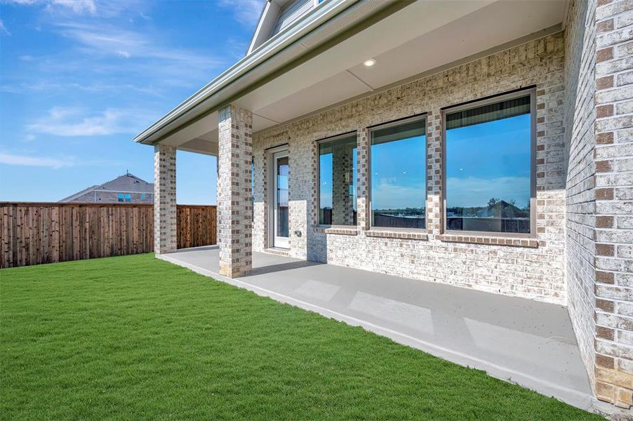 Exterior details and patio area of a home in Northshore at Lakewood Village - Classic Series, Lakewood Village (Image 2).