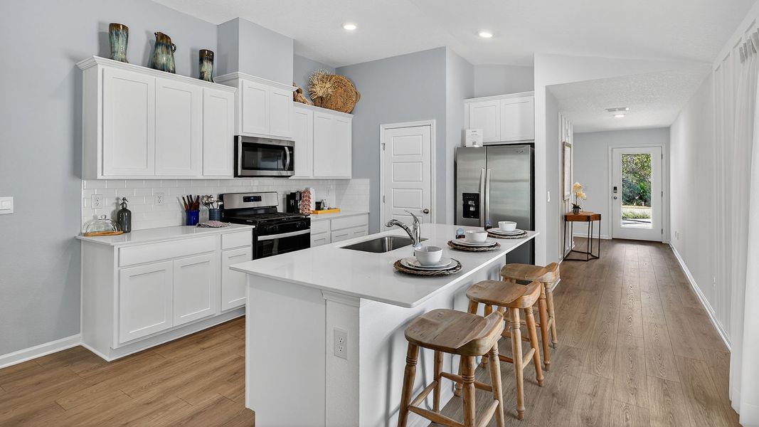 Representative furnished interior of a home built from the Berkeley II by D.R. Horton in Copes Landing, Jacksonville (Image 8).