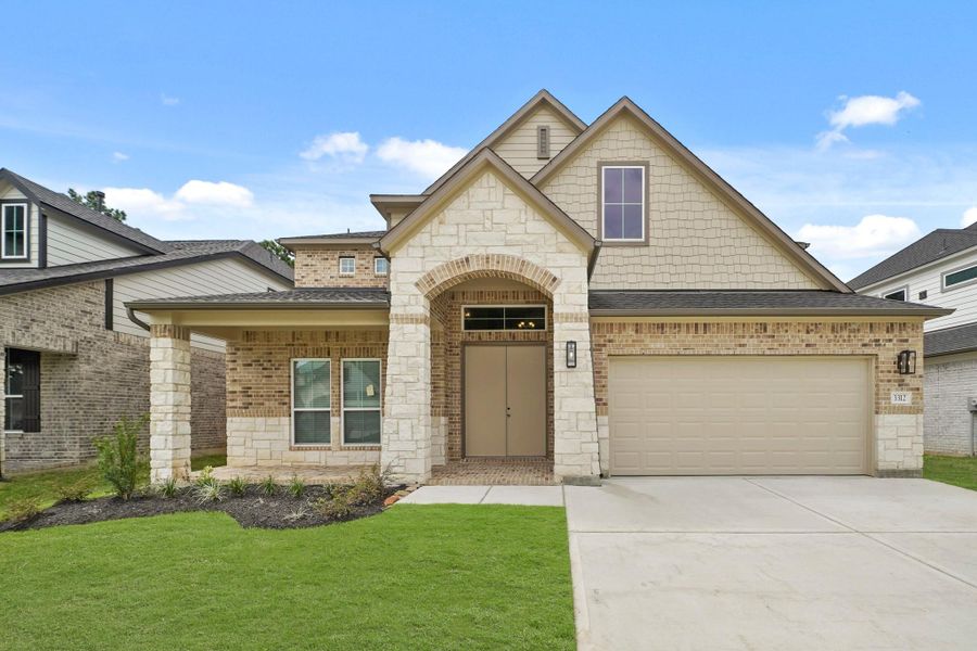 Front exterior of a new home in Barton Creek Ranch, Conroe, TX, highlighting curb appeal (Image 2).