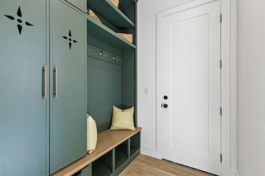 Mudroom with light wood-style flooring