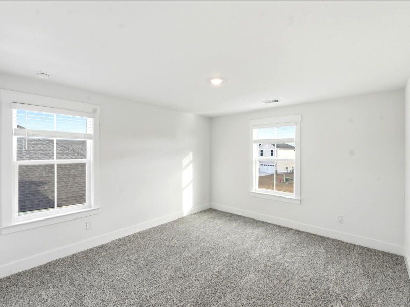 Spacious, unfurnished interior of a new home in The Coves at Lakes of Cane Bay II, Summerville (Image 31).