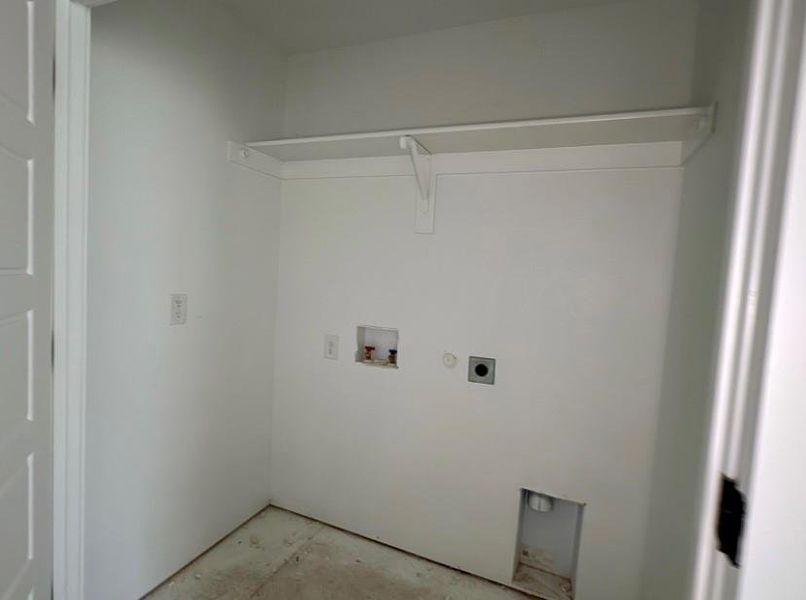 Laundry room with hookup for a washing machine and hookup for an electric dryer Laundry room with hookup for a washing machine and hookup for an electric dryer