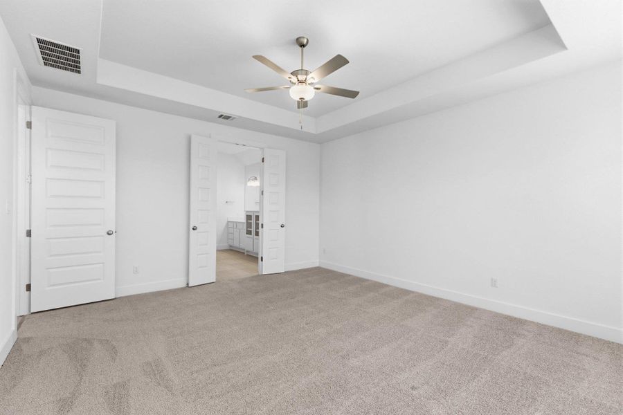 Primary Bedroom with tray ceiling