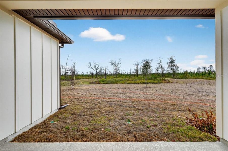 Exterior details and patio area of a home in Stables at Cary Forest, Bryceville (Image 4).