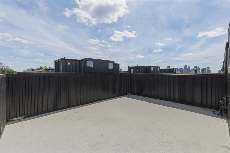 View of patio featuring a skyline view